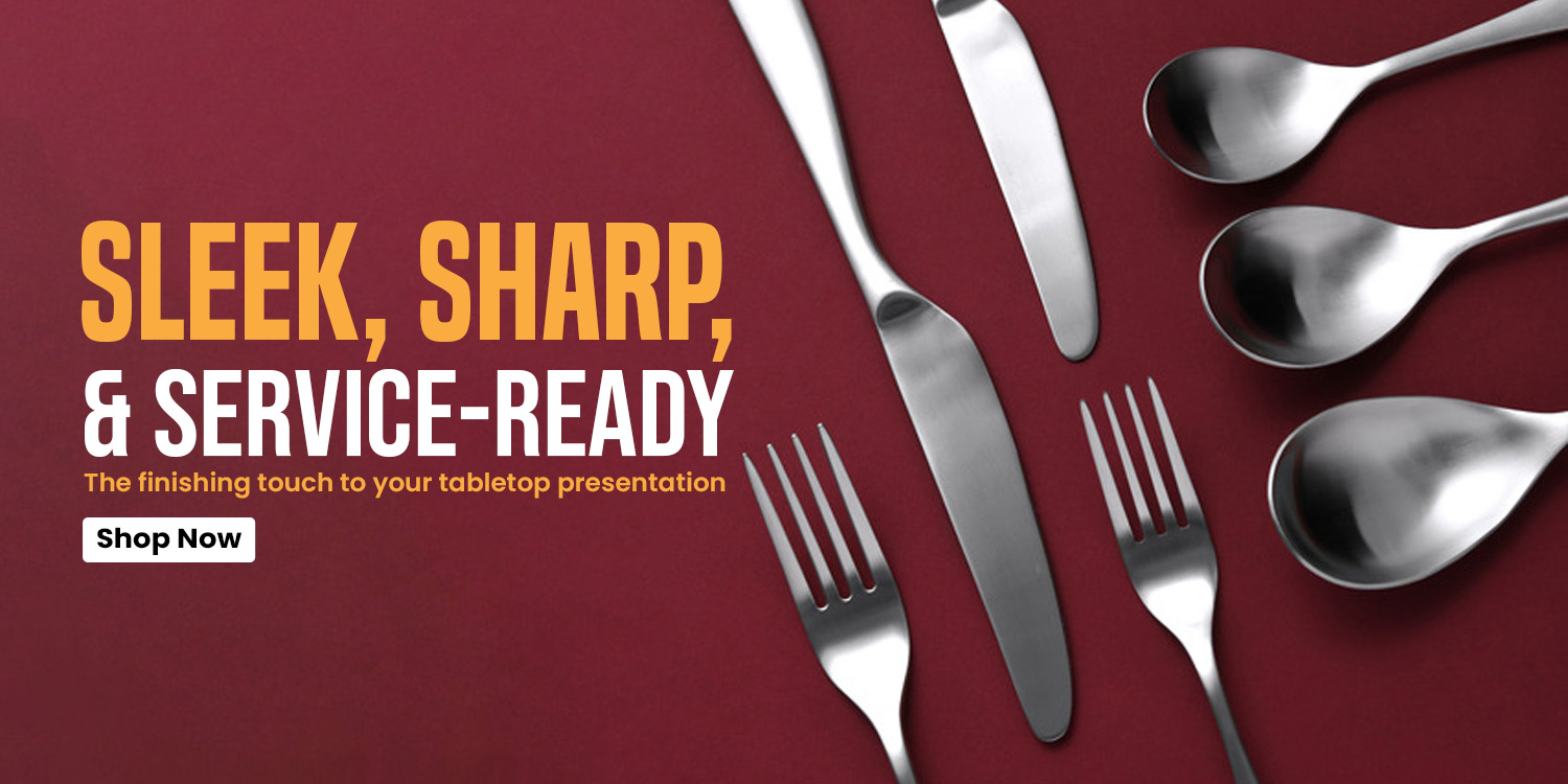 A close-up of a sleek and sharp stainless steel flatware set, including service-ready forks, knives, and spoons for restaurants.